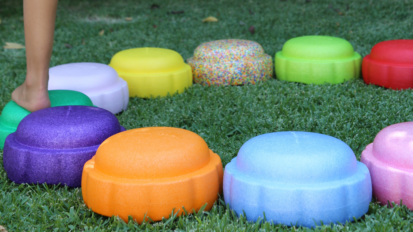 Colorful fun versatile stacking stones, stepping stones made out of lightweight Expended Polypropylene foam for kids for movement, open ended play, active learning, creativity, exercise, social development, motor development, cognitive development. can be combined with the balance board