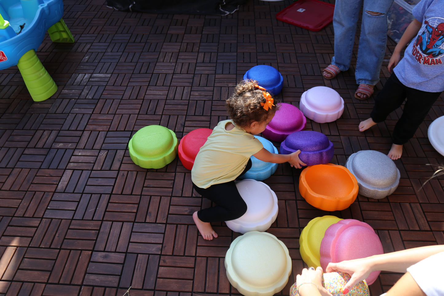 Colorful fun versatile stacking stones, stepping stones made out of lightweight Expended Polypropylene foam for kids for movement, open ended play, active learning, creativity, exercise, social development, motor development, cognitive development. can be combined with the balance board