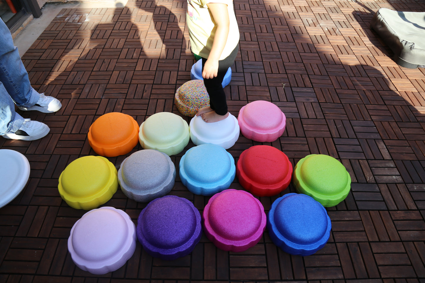 Colorful fun versatile stacking stones, stepping stones made out of lightweight Expended Polypropylene foam for kids for movement, open ended play, active learning, creativity, exercise, social development, motor development, cognitive development. can be combined with the balance board