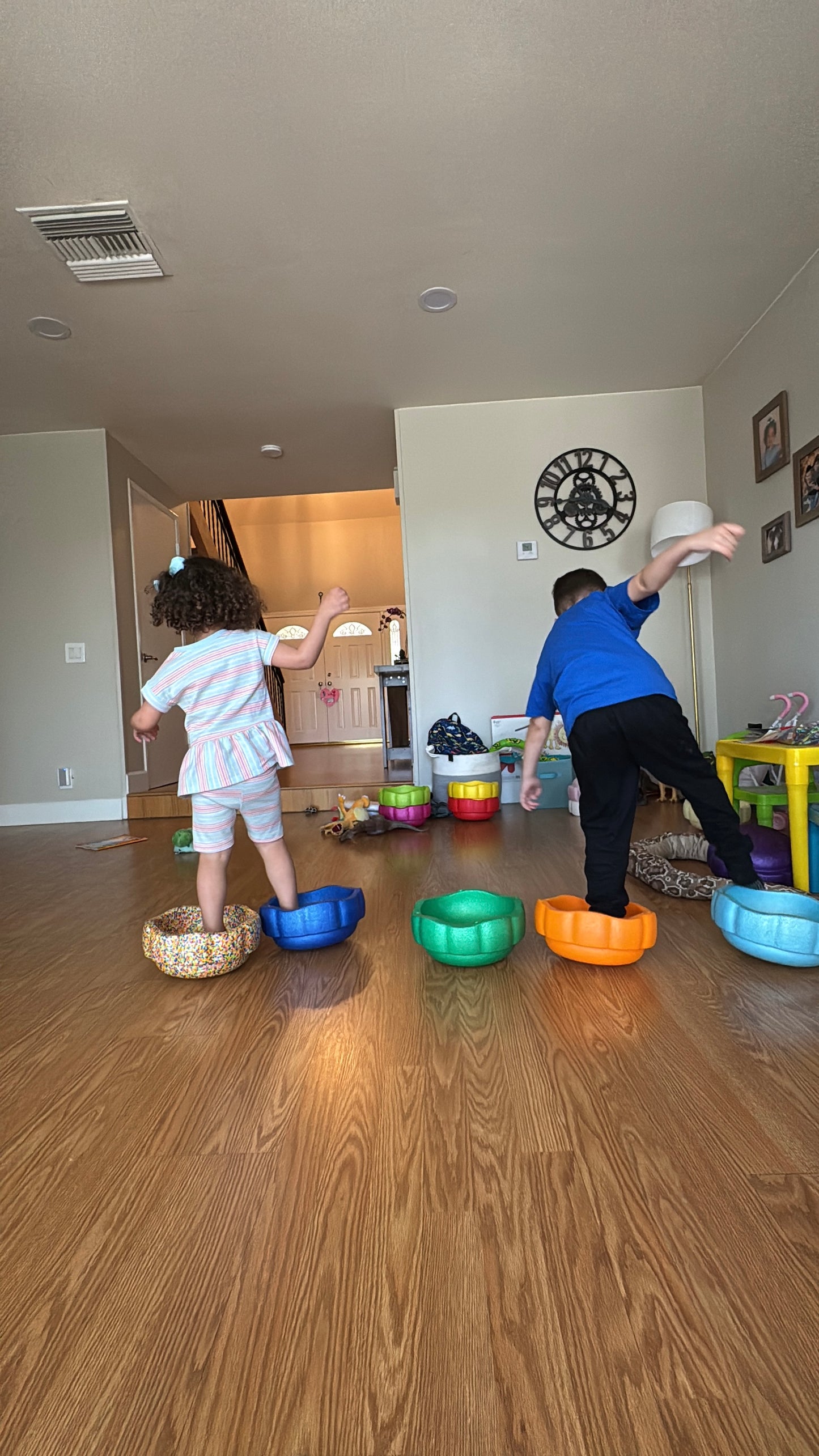 Colorful fun versatile stacking stones, stepping stones made out of lightweight Expended Polypropylene foam for kids for movement, open ended play, active learning, creativity, exercise, social development, motor development, cognitive development. can be combined with the balance board