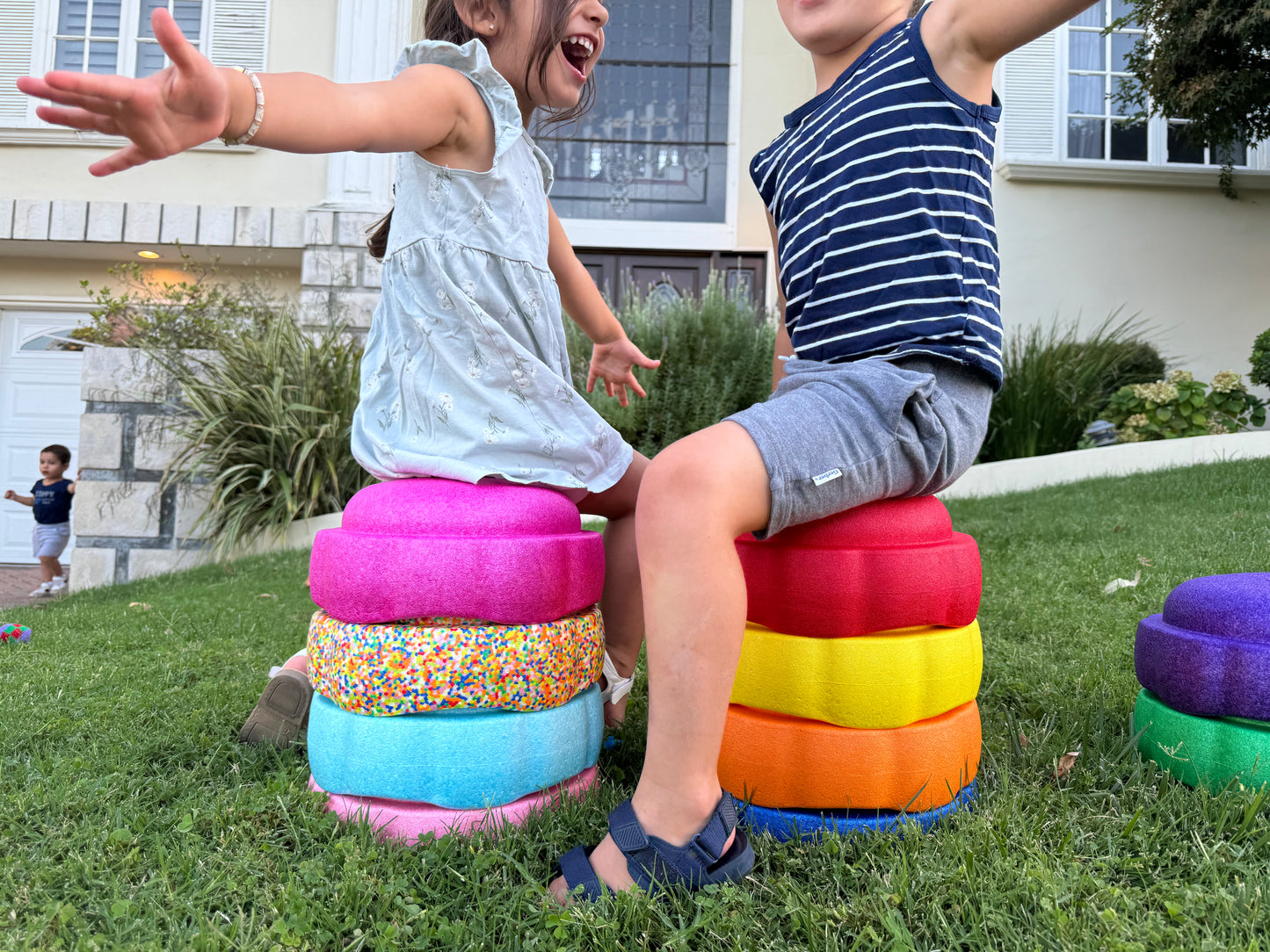 Colorful fun versatile stacking stones, stepping stones made out of lightweight Expended Polypropylene foam for kids for movement, open ended play, active learning, creativity, exercise, social development, motor development, cognitive development. can be combined with the balance board