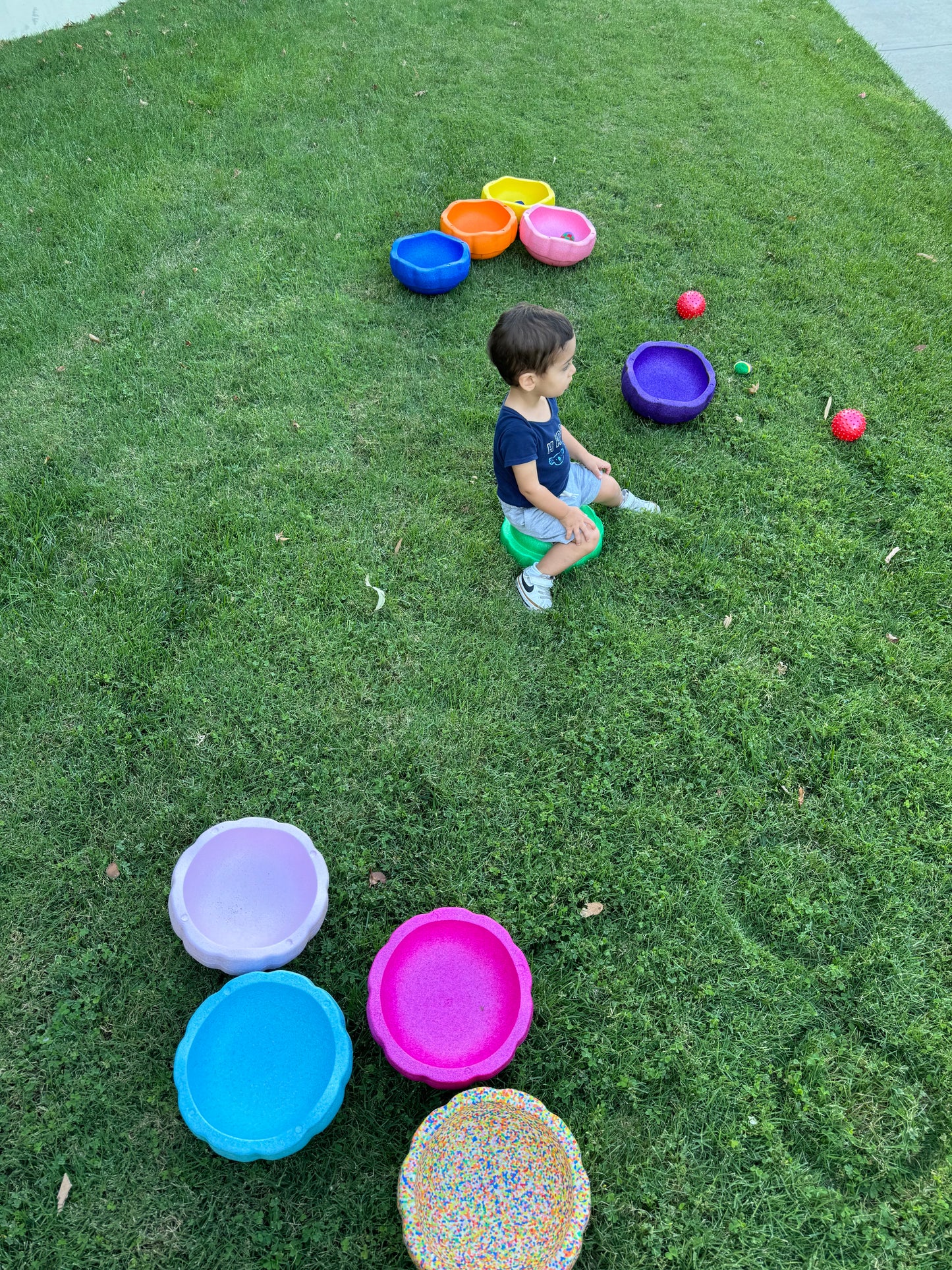 Colorful fun versatile stacking stones, stepping stones made out of lightweight Expended Polypropylene foam for kids for movement, open ended play, active learning, creativity, exercise, social development, motor development, cognitive development. can be combined with the balance board