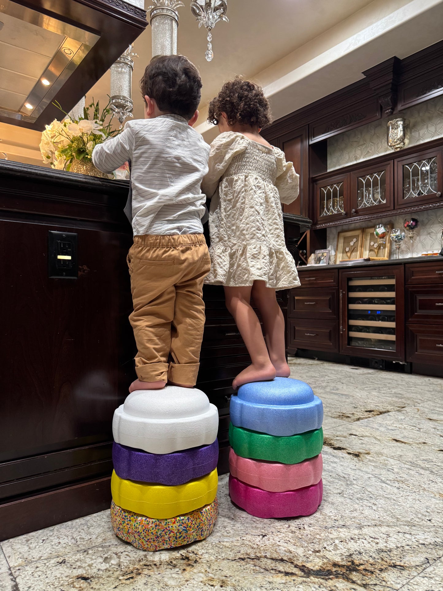 Colorful fun versatile stacking stones, stepping stones made out of lightweight Expended Polypropylene foam for kids for movement, open ended play, active learning, creativity, exercise, social development, motor development, cognitive development. can be combined with the balance board