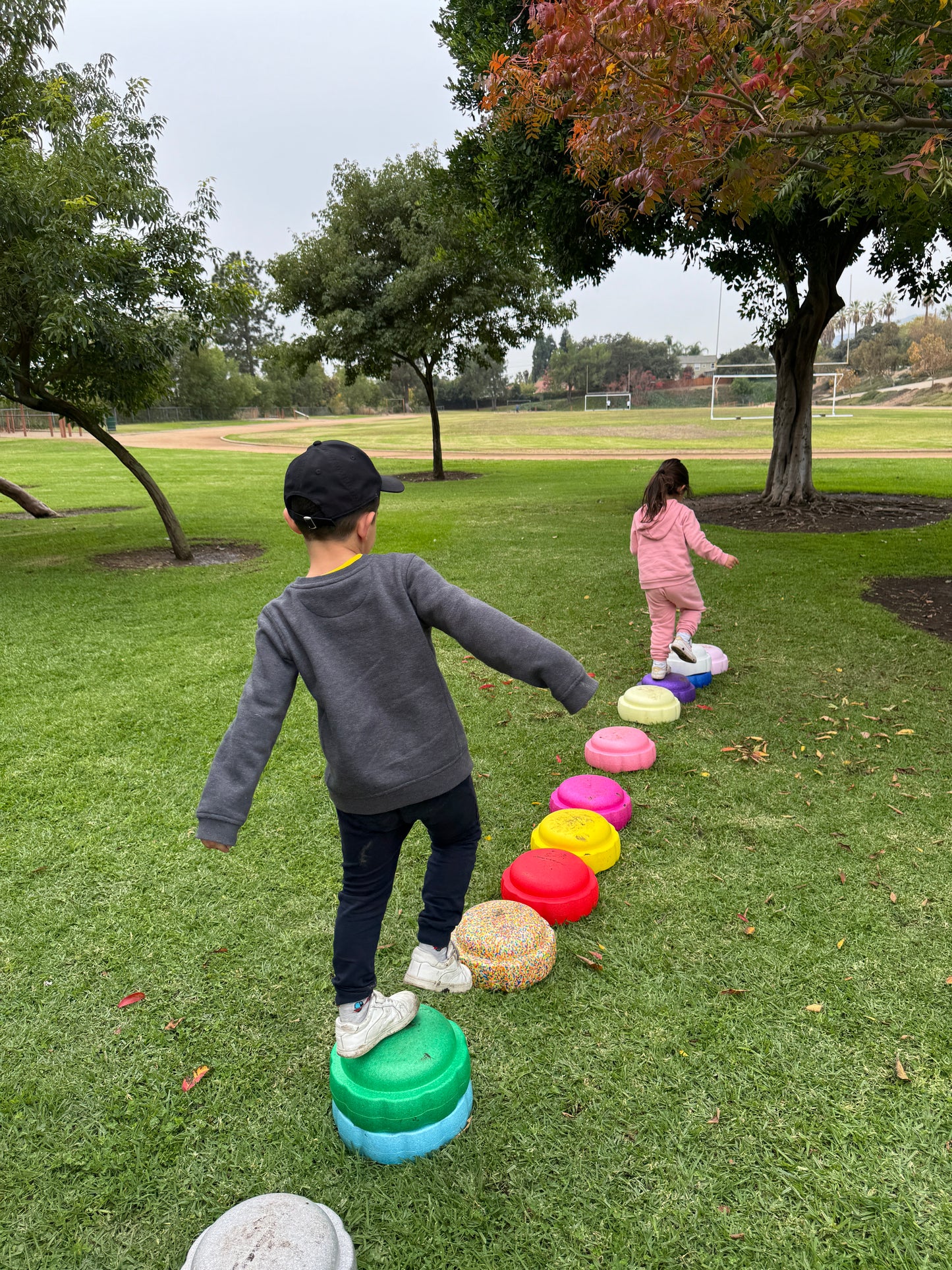 Colorful fun versatile stacking stones, stepping stones made out of lightweight Expended Polypropylene foam for kids for movement, open ended play, active learning, creativity, exercise, social development, motor development, cognitive development. can be combined with the balance board