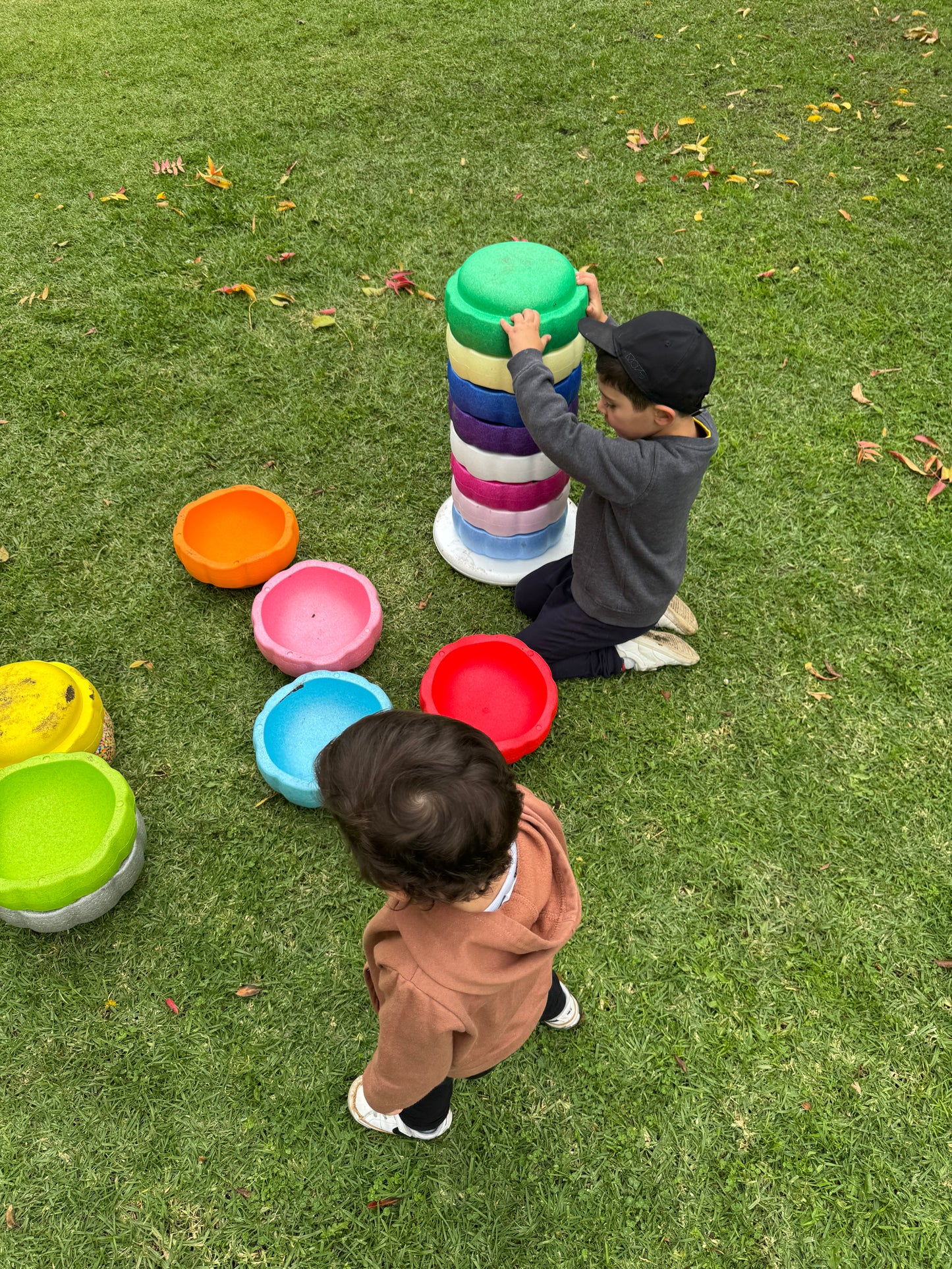 Colorful fun versatile stacking stones, stepping stones made out of lightweight Expended Polypropylene foam for kids for movement, open ended play, active learning, creativity, exercise, social development, motor development, cognitive development. can be combined with the balance board