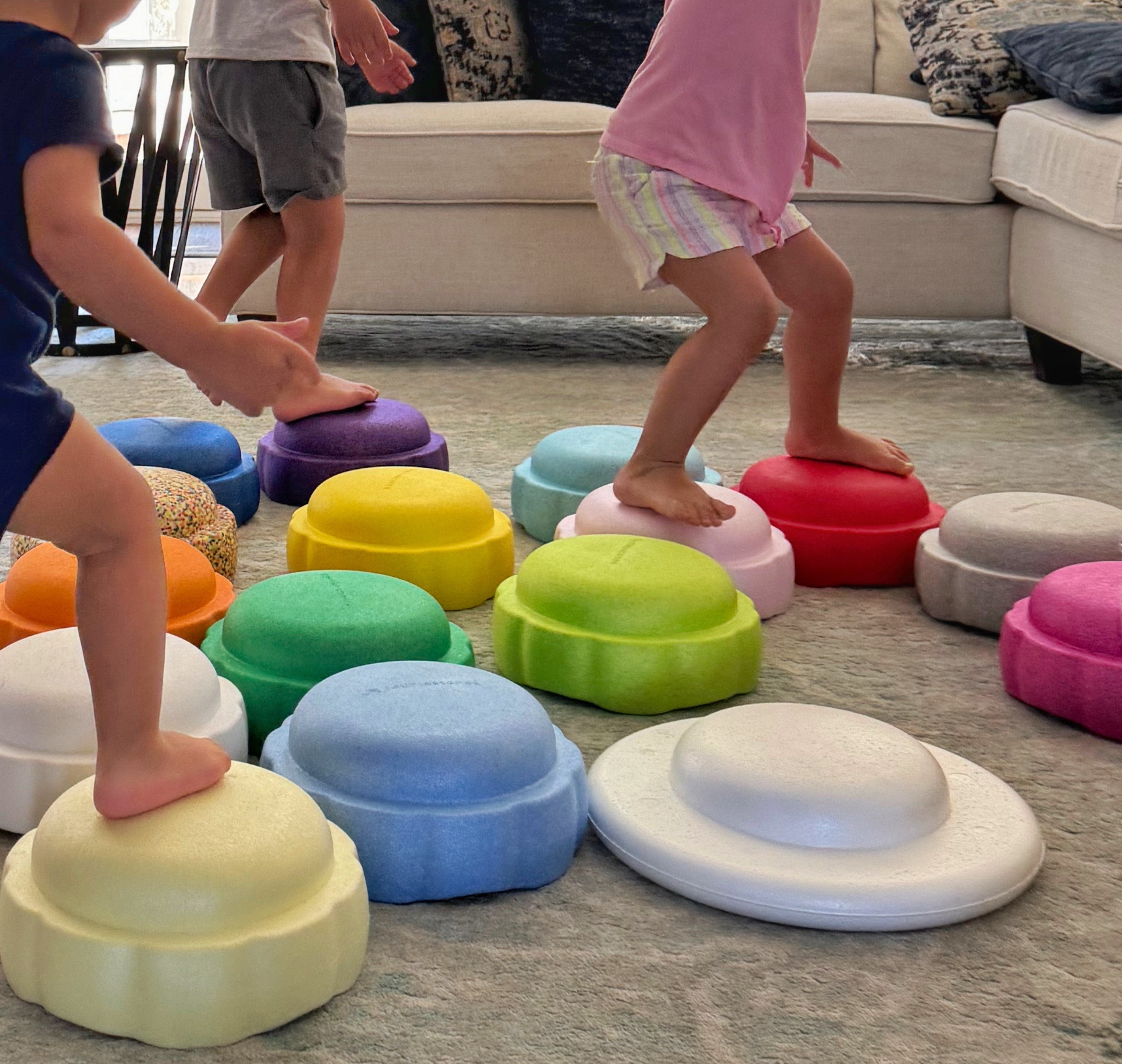 kids stepping on colorful foam steppingstones