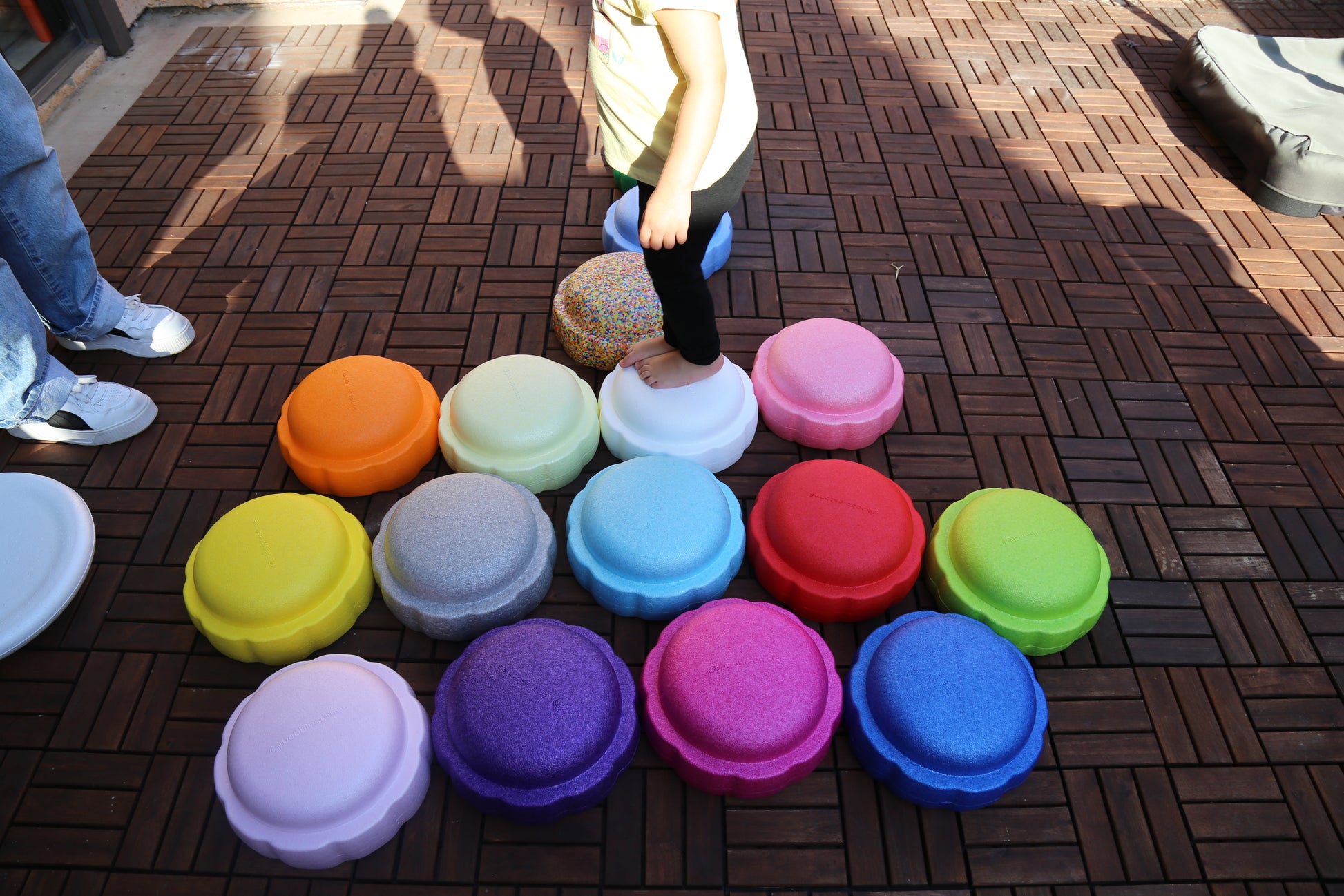 Colorful fun versatile stacking stones, stepping stones made out of lightweight Expended Polypropylene foam for kids for movement, open ended play, active learning, creativity, exercise, social development, motor development, cognitive development. can be combined with the balance board
