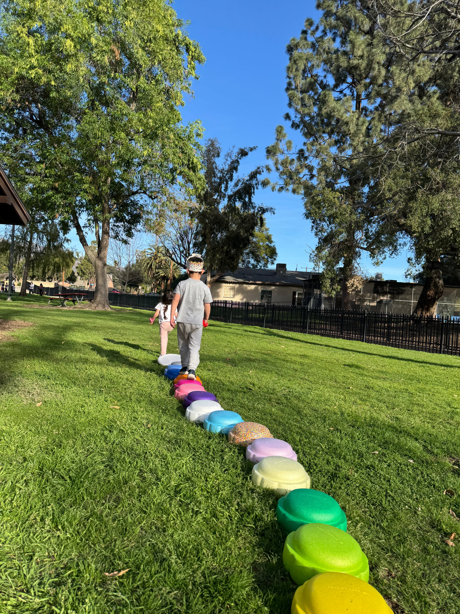 Colorful fun versatile stacking stones, stepping stones made out of lightweight Expended Polypropylene foam for kids for movement, open ended play, active learning, creativity, exercise, social development, motor development, cognitive development. can be combined with the balance board