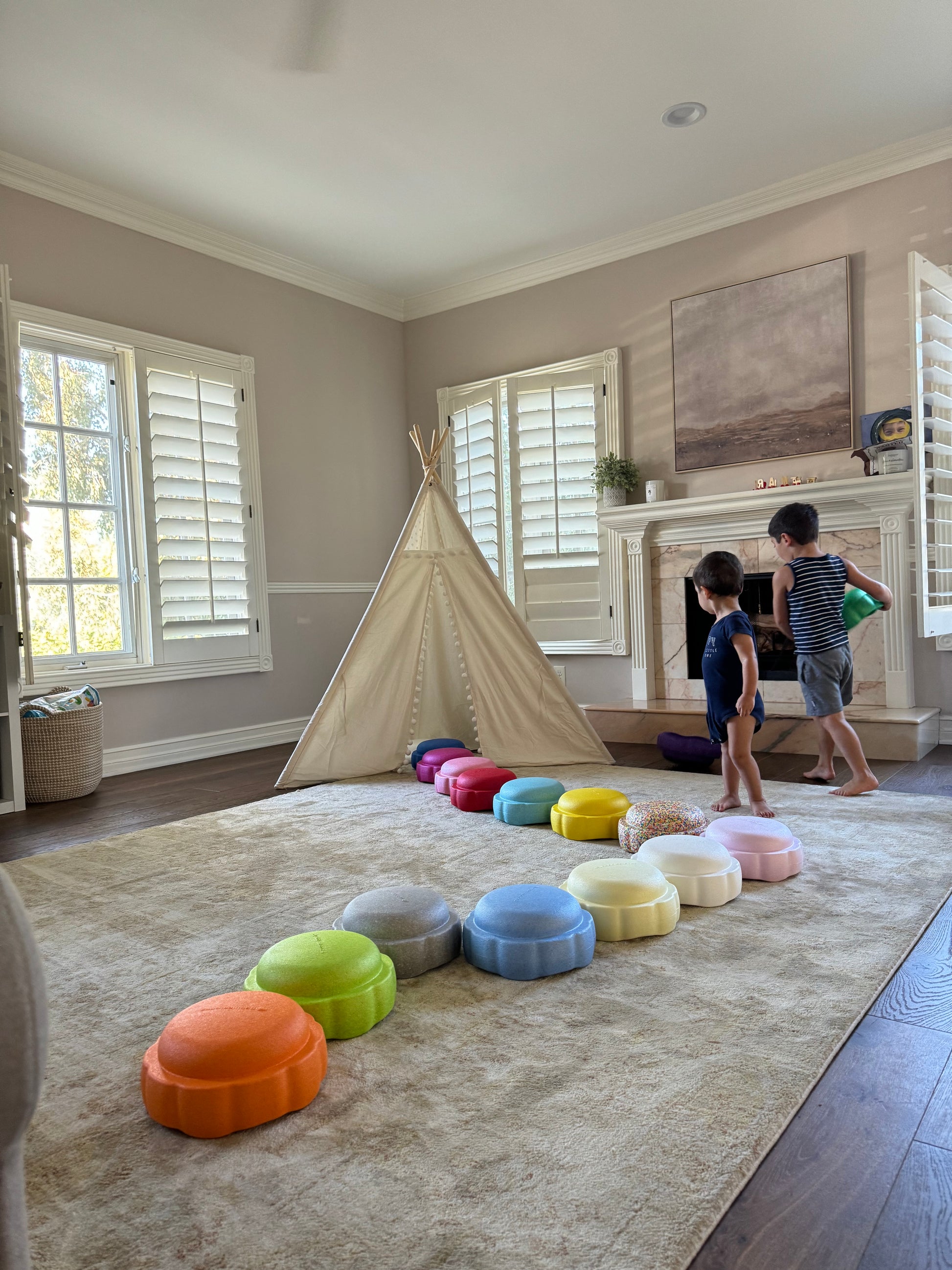 Colorful fun versatile stacking stones, stepping stones made out of lightweight Expended Polypropylene foam for kids for movement, open ended play, active learning, creativity, exercise, social development, motor development, cognitive development. can be combined with the balance board