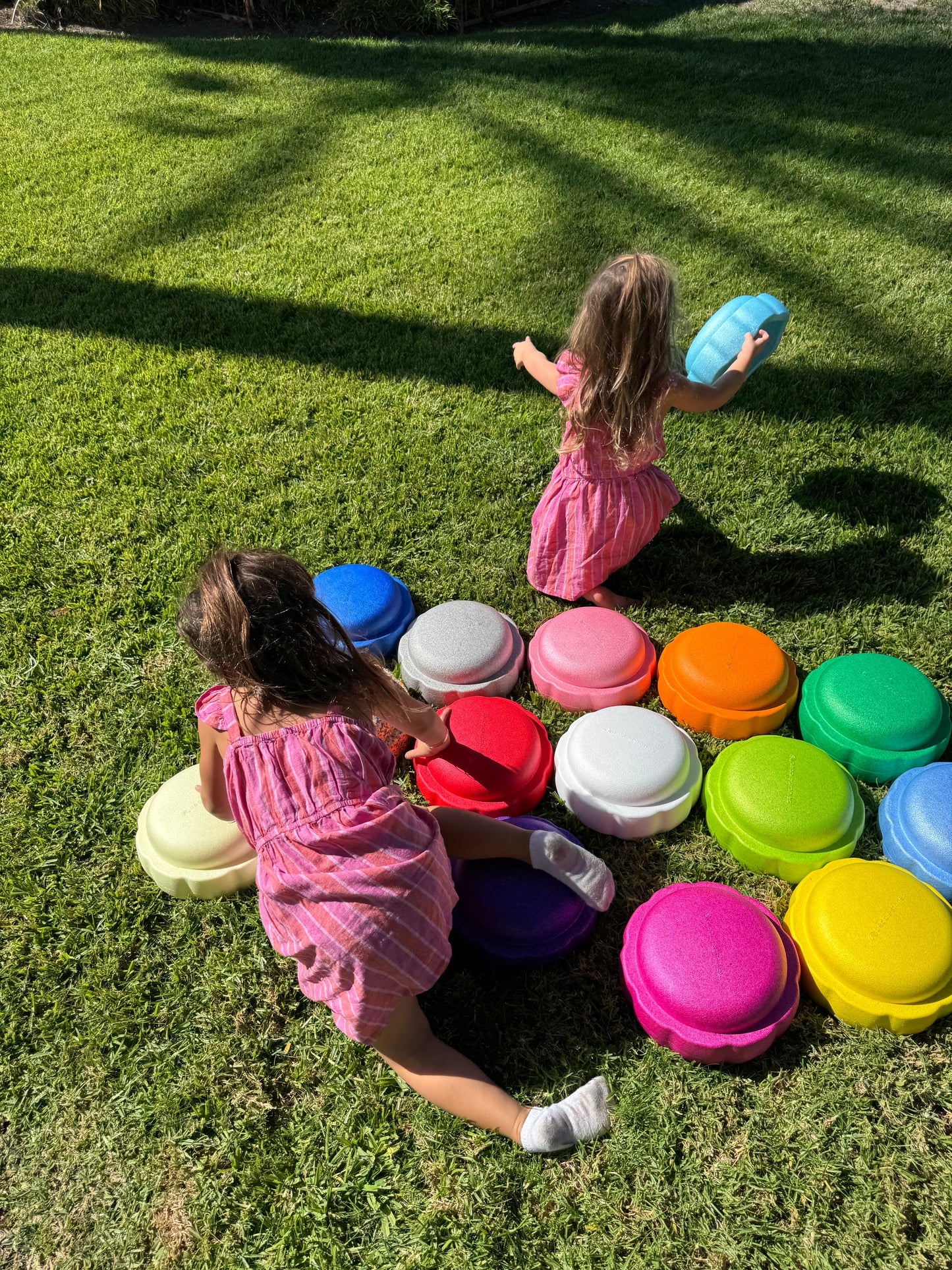 Colorful fun versatile stacking stones, stepping stones made out of lightweight Expended Polypropylene foam for kids for movement, open ended play, active learning, creativity, exercise, social development, motor development, cognitive development. can be combined with the balance board