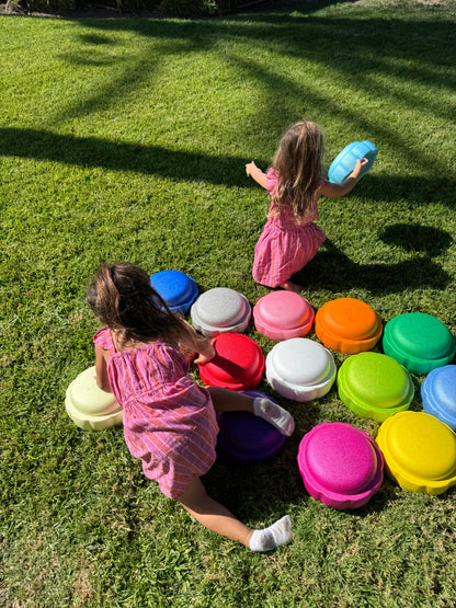 Colorful fun versatile stacking stones, stepping stones made out of lightweight Expended Polypropylene foam for kids for movement, open ended play, active learning, creativity, exercise, social development, motor development, cognitive development. can be combined with the balance board
