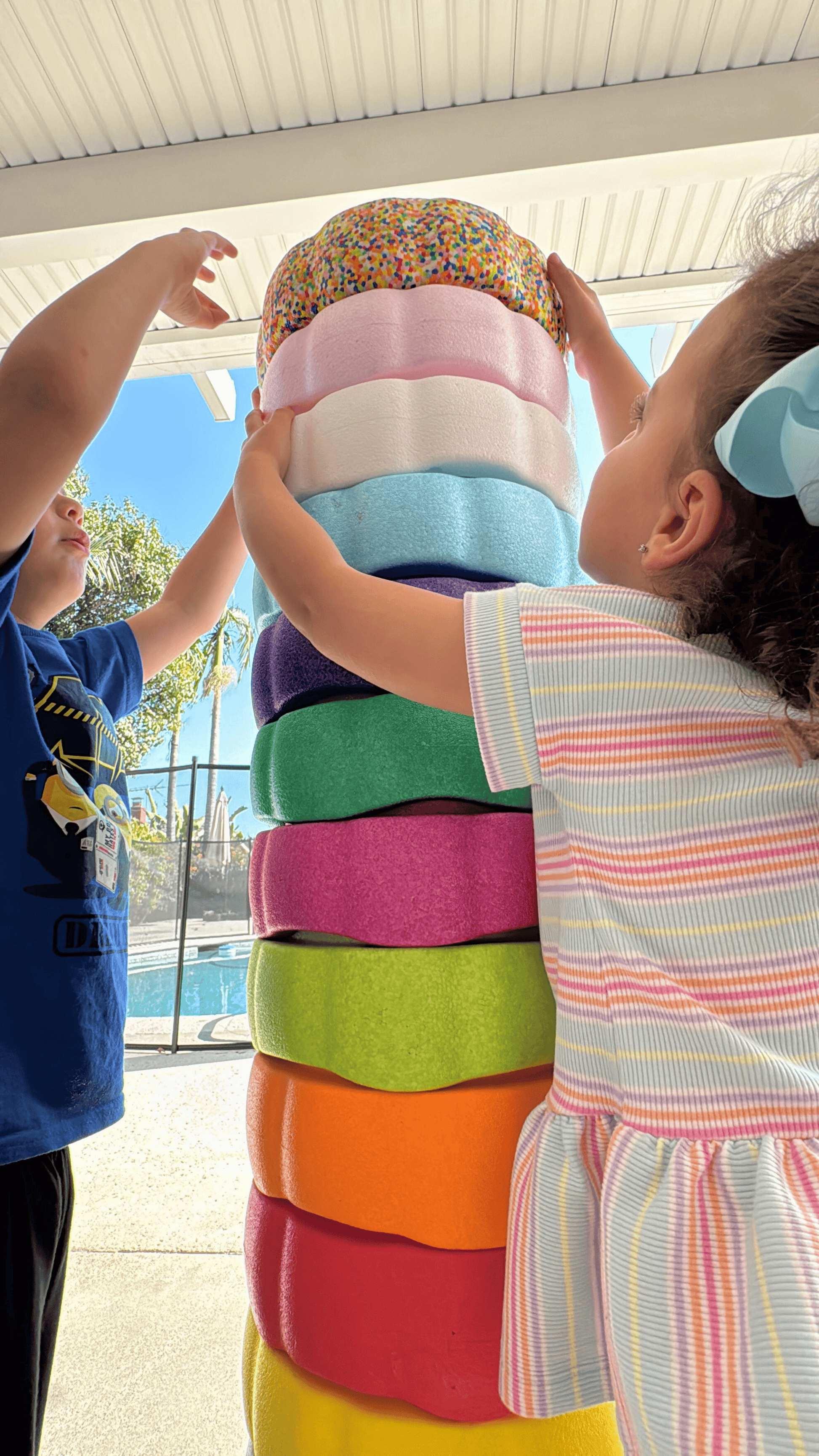 Colorful fun versatile stacking stones, stepping stones made out of lightweight Expended Polypropylene foam for kids for movement, open ended play, active learning, creativity, exercise, social development, motor development, cognitive development. can be combined with the balance board